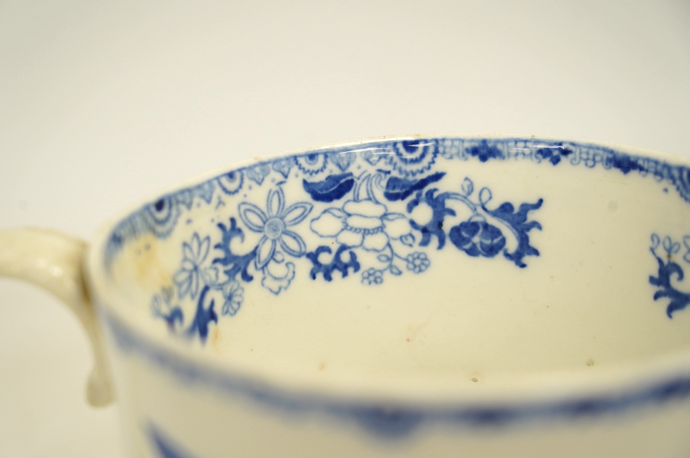 An early Victorian blue and white bone china mug, 13cm high. Condition - fair, crack to the handle